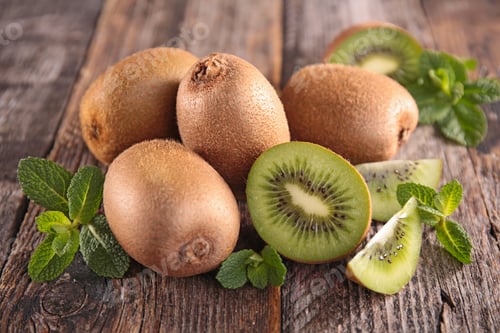 Kiwi Fruit and Mint on a Wooden Board