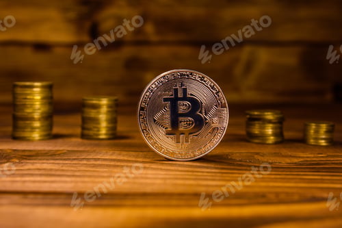Preview: Bitcoin And Stack Of Coins On Rustic Wooden Table
