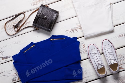 Preview: Folded Sweater And White Shoes. Blue Sweatshirt And Dark Purse. Girl'S Comfortable Spring Clothing