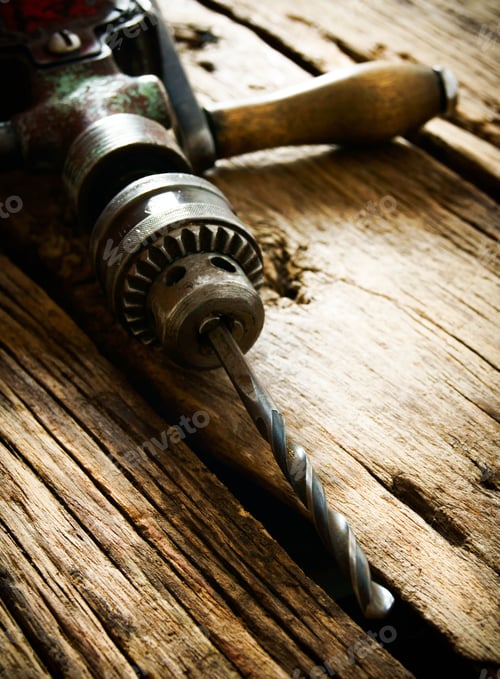 Preview: Vintage Hand Drill on Weathered Wooden Surface