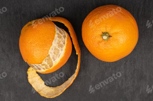 Preview: Group Of Two Whole Fresh Orange Mandarin Flatlay On Grey Stone