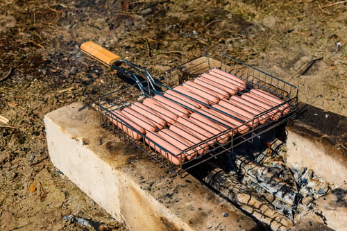 Preview: Sausages Cooking In Barbecue Grill On Campfire