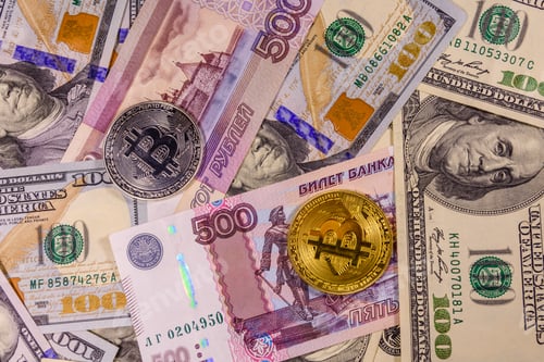 Preview: Bitcoin Coins On American And Russian Banknotes