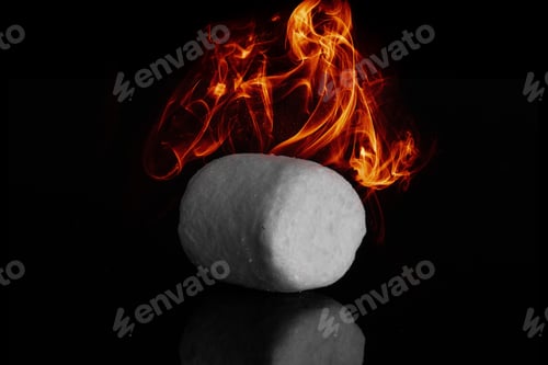Preview: One Sweet Fluffy Marshmallow With Fire Isolated On Black Glass
