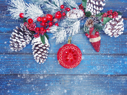 Preview: Winter Christmas Background With Decor On Fir Branches Cones And Snow On Blue Wooden Texture