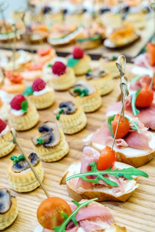 Delicious Appetizers with Fresh Ingredients on Wooden Surface