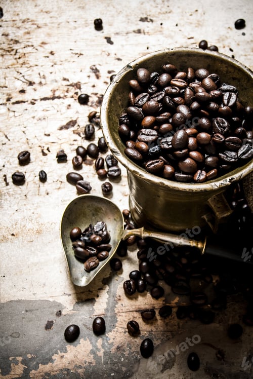 Preview: Fresh Roasted Coffee In Old Mortar. On The Rustic Background.