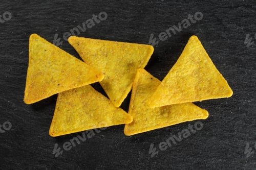 Preview: Group Of Five Whole Cheese Tortilla Chips Flatlay On Grey Stone