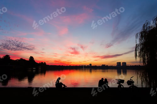 Preview: Romantic Couple On A Lake At Sunset With Bike