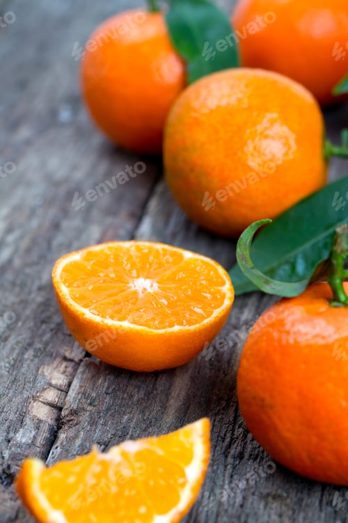 Preview: Tangerines With Leaves On Wooden Table