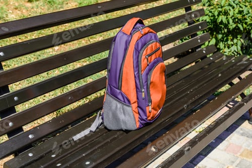 Preview: Tourist Backpack On Bench In City Park