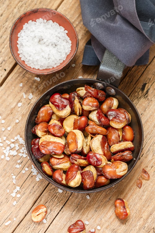 Preview: Vicia Faba. Crispy Fried (Roasted) Broad Beans With Salt In A Frying Pan Close-Up On A Wooden Old