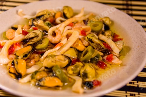 Preview: Ceramic Plate With Different Sea Food And Olives On Bamboo Mat