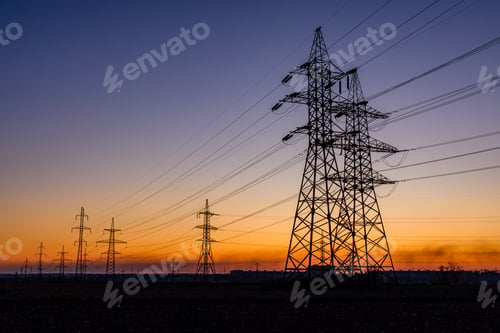 Preview: High Voltage Power Line In Field At Sunset