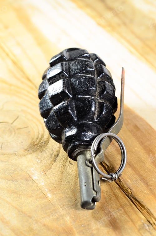 Preview: Black Hand Grenade On The Wooden Table