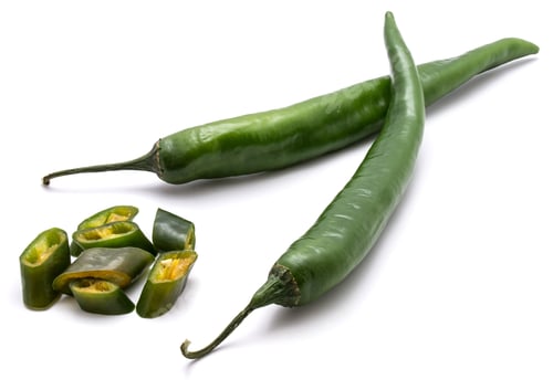 Preview: Two Whole Green Chilli And Slices Isolated On White Background