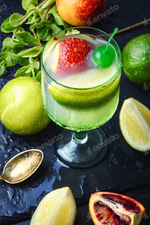 Preview: Tropical Citrus Fruit And Refreshing Drink On The Slate Stylish Blue Background