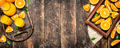 Preview: Fresh Juice From Ripe Oranges. On Wooden Background.