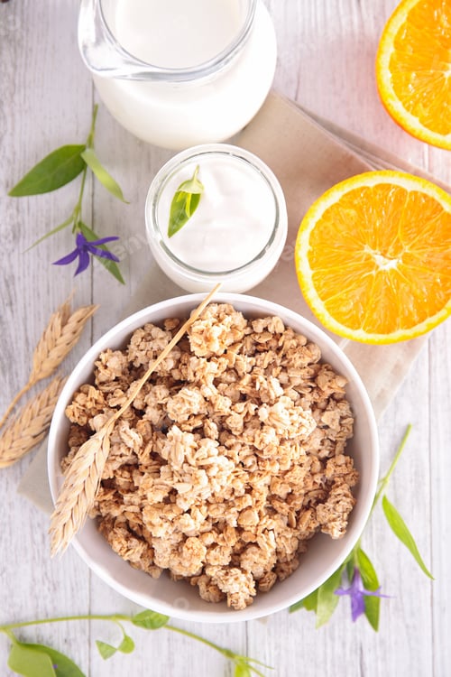 Preview: Bowl Of Cereal With Milk And Orange