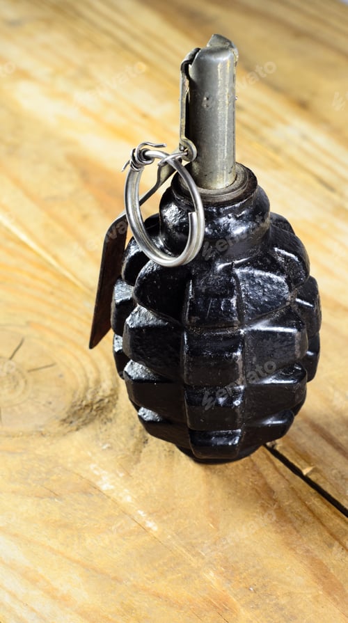 Preview: Black Hand Grenade On The Wooden Table