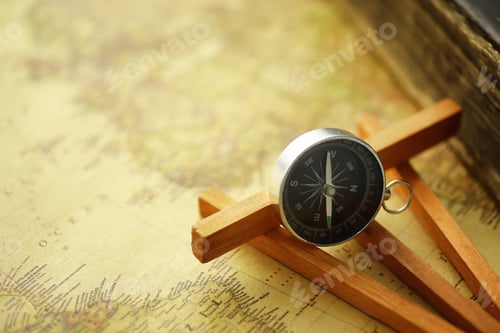 Preview: Travel And Adventure Search Concept. Vintage Aged Map With Shabby Book And Compass. Shabby Book And