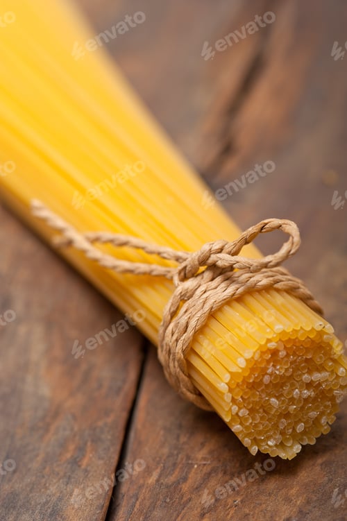 Preview: Italian Pasta Spaghetti Tied With A Rope On A Rustic Table