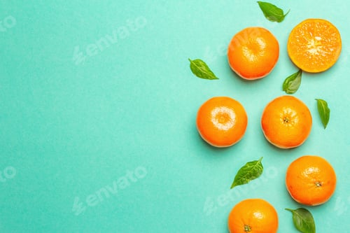 Preview: Ripe Juicy Tangerines And Fresh Leaves. Sunny Summer Turquoise Background, Top View