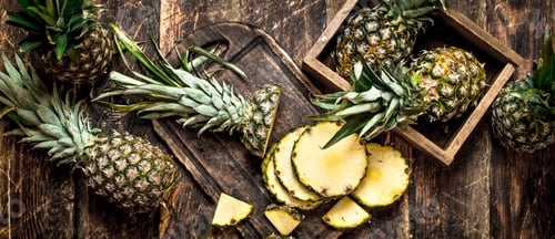 Preview: Sliced Fresh Pineapple. On The Wooden Background.