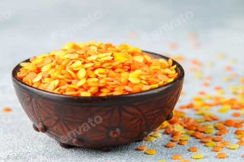 Preview: Assortment Of Dry Multicolored Lentils In A Clay Bowl Close-Up. Yellow And Red Cereals. Variety Of