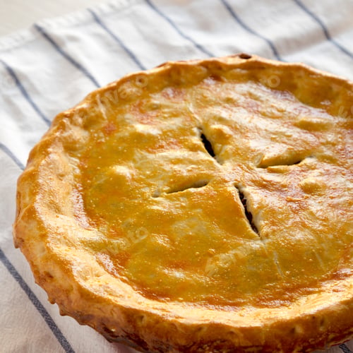 Preview: Delicious Homemade Canadian Tourtiere Meat Pie On Cloth, Low Angle View.
