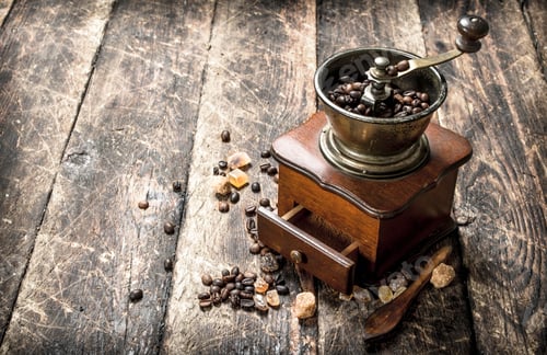 Preview: Coffee Grinder With Coffee Beans. On A Wooden Background.