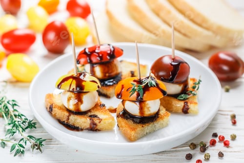 Preview: White Bread Toast With Tomato Cherry, Mozzarella Cheese, Thyme And Balsamic Glaze On White Wooden