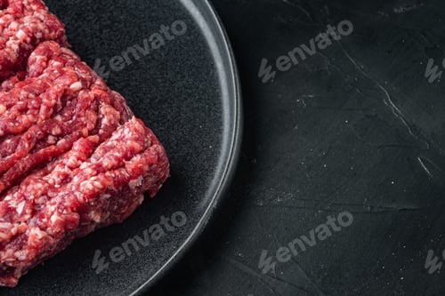 Preview: Raw Minced Fresh Meat, On Black Background With Copy Space For Text
