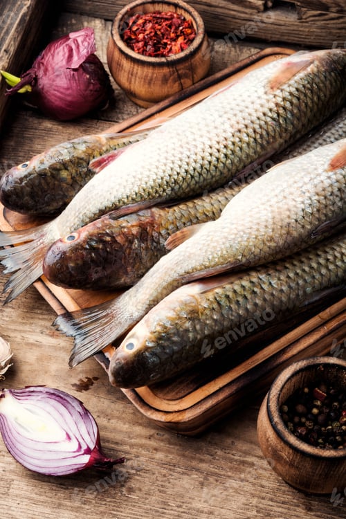 Preview: Fresh Raw Fish On Wooden Cutting Board.Raw Fish With Spices For Cooking