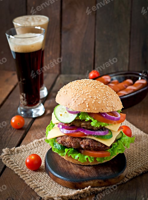 Preview: Big Juicy Hamburger With Vegetables And Beef On A Wooden Background In Rustic Style