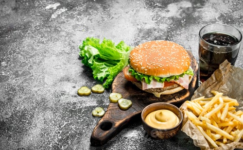 Preview: Street Food. Burger With Fries, Sauce And Cola. On A Rustic Background.