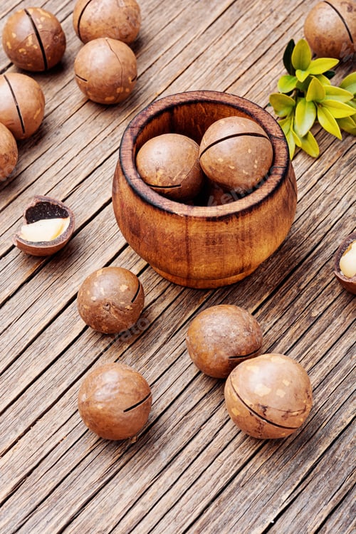 Preview: Macadamia Nuts In Shell On Old Wooden Table