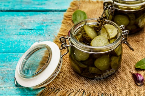 Preview: Marinated Pickled Cucumbers With Spices And Herbs. Traditional Fermented Appetizer In Glass Jar And