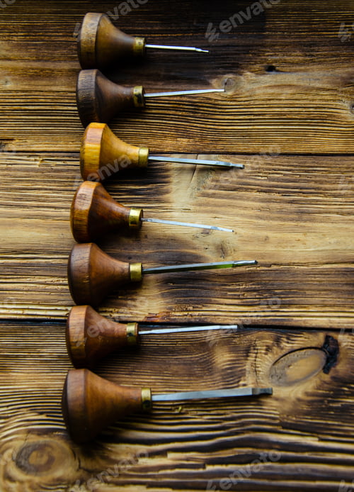 Preview: Different Gravers For Jewelry On A Wooden Background