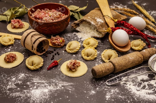 Preview: Composition With Raw Dumplings And Ingredients On Trendy Black Stone Concrete Background. Process
