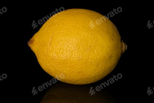 Preview: One Whole Fresh Yellow Lemon Isolated On Black Glass