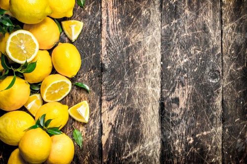 Preview: Fresh Lemons With Leaves. On A Wooden Background.