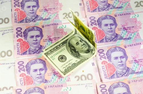 Preview: One Hundred Dollars Banknotes On The Heap Of Ukrainian Hryvnas