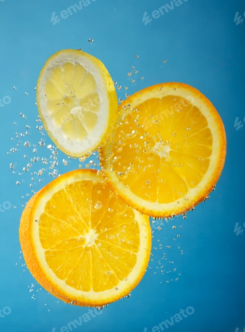 Preview: Fresh Orange Dropped Into Water