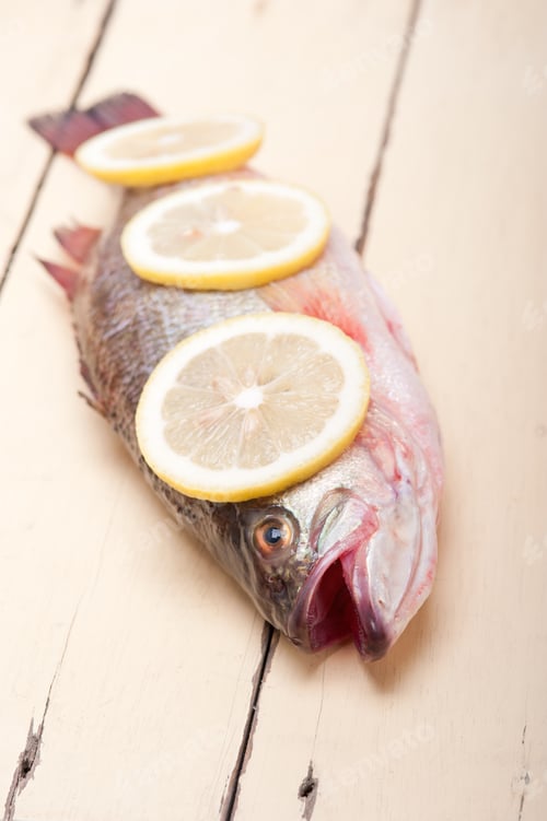 Preview: Fresh Whole Raw Fish On A Wooden Table Ready To Cook
