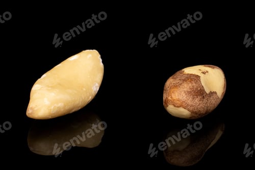 Preview: Group Of Two Whole Brazil Brown Nut Isolated On Black Glass