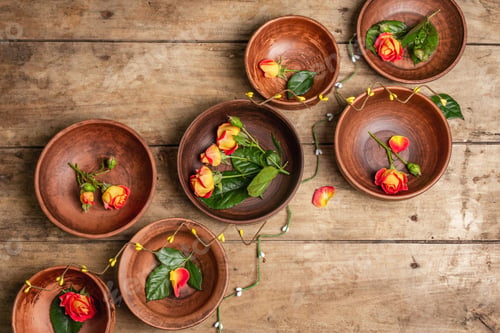 Preview: Assorted Ceramic Bowls With Fresh Flowers On A Vintage Table. Collection Of Traditional Dishes And