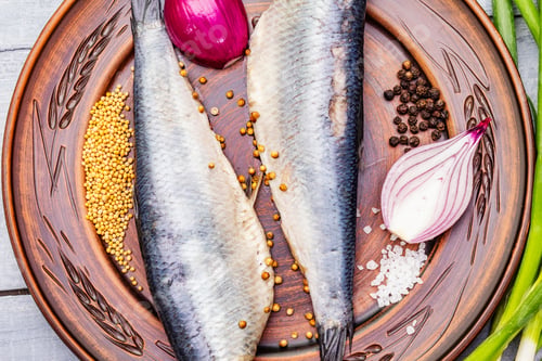 Preview: Traditional Norwegian Slightly Salted Herring. Healthy Seafood Concept. Vegetarian Ingredient With