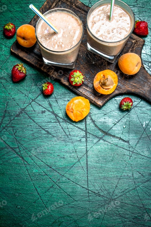 Preview: Smoothie With Peaches, Strawberries And Chocolate. On Rustic Background.