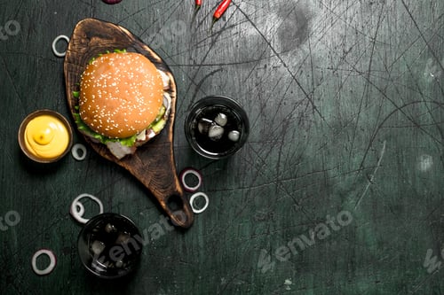 Preview: Fast Food. Burger With Cola And Sauce. On A Rustic Background.